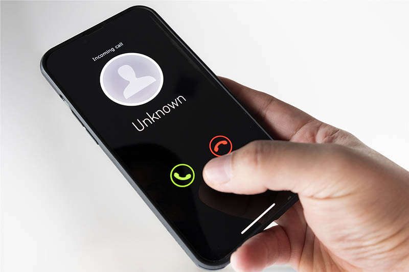 A phone showing an incoming call from an unknown number.