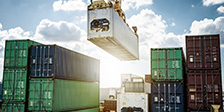 shipping container being lowered on to ground