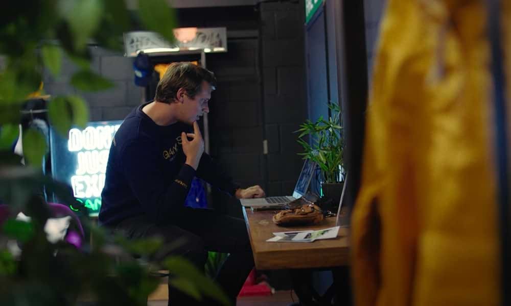 Man working at desk on laptop