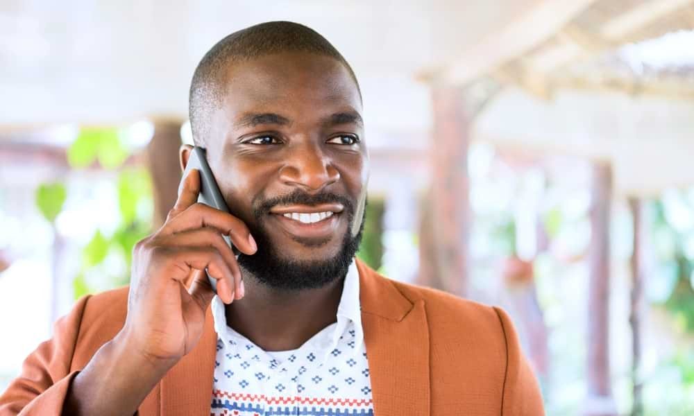 Man talking on phone outside