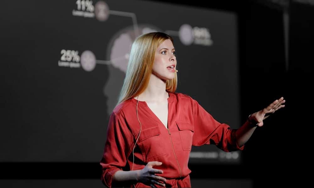 Woman presenting on stage