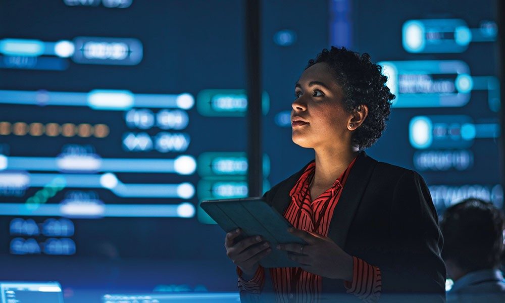 Woman surrounded by screens on tablet