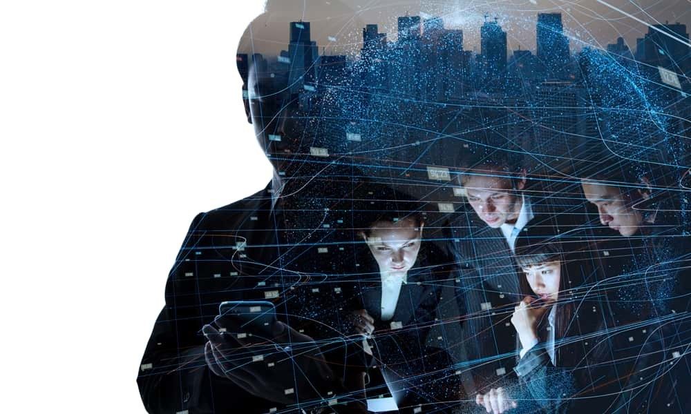 Group of workers on laptop inside silhouette of man